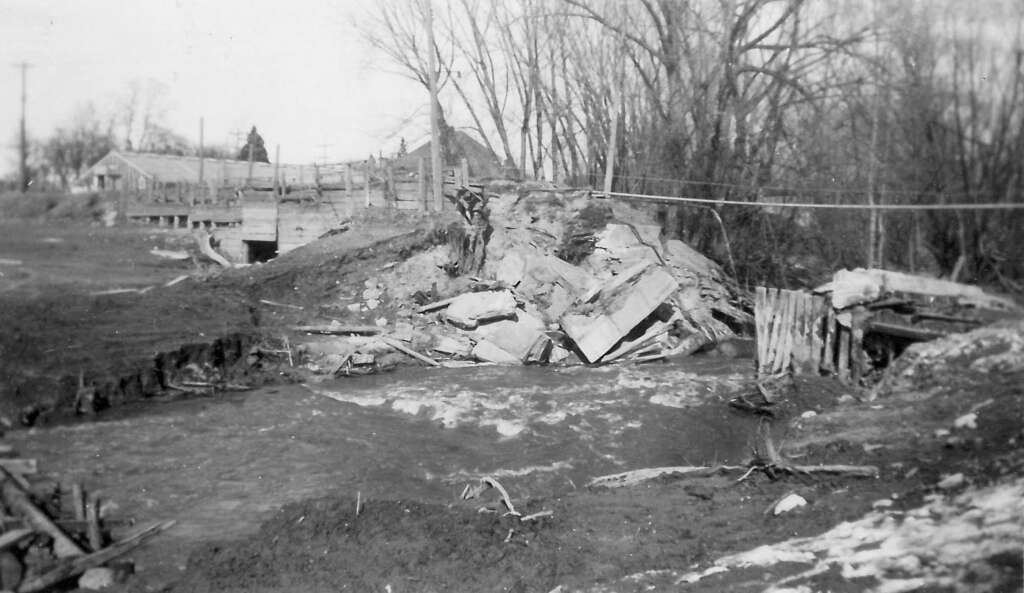 1942: millpond dam and bridge destroyed by spring flood waters.